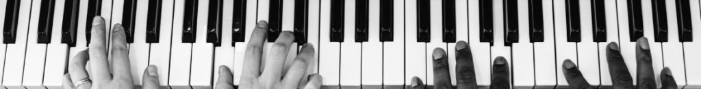 Piano Lessons Markham Banner: 2 people playing a duet on piano