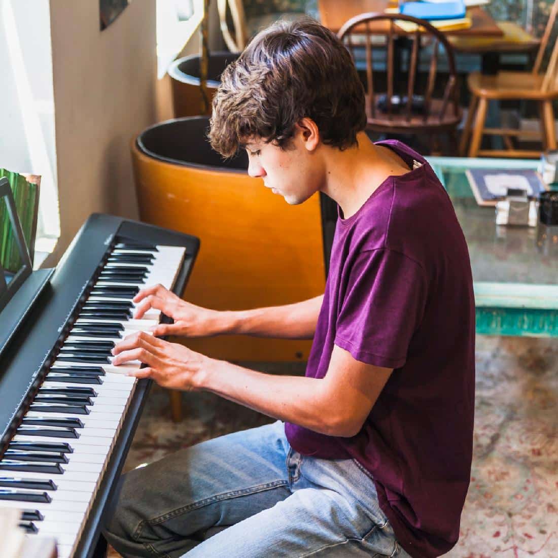 Boy playing piano at home
in home piano lessons