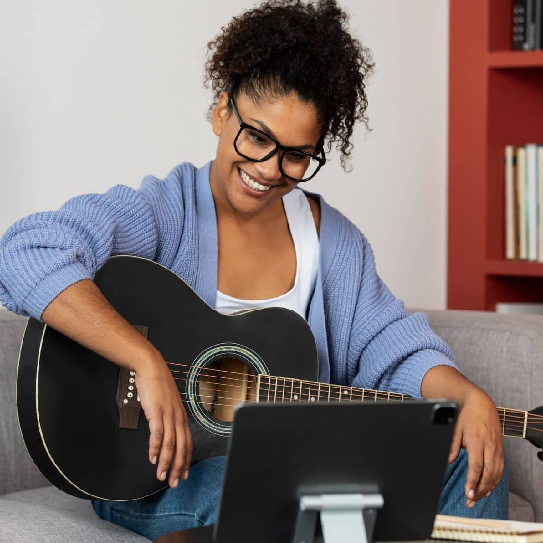 Woman taking online music lessons